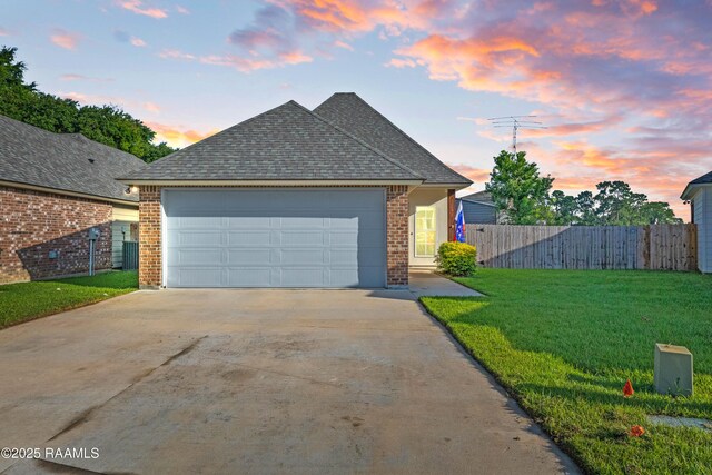 119 Alpine Dr, Lafayette, LA 70506 - view of front of property with brick siding, driveway, a garage, and a shingled roof