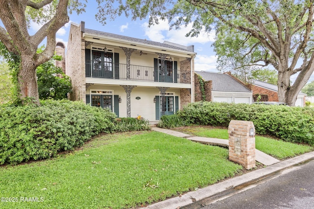 104 Georgetown Loop, Lafayette, LA 70506 - view of front of home with a balcony, a front lawn, a garage, and ceiling fan