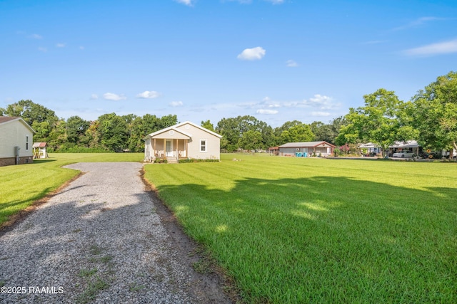1044 Babineaux Rd, Breaux Bridge, LA 70517 - view of green lawn with driveway