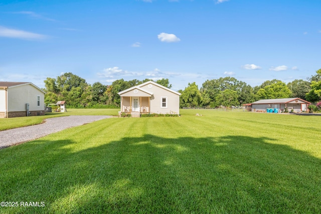 1044 Babineaux Rd, Breaux Bridge, LA 70517 - view of grassy yard with gravel driveway