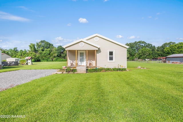 1044 Babineaux Rd, Breaux Bridge, LA 70517 - view of front of home featuring covered porch and a front lawn
