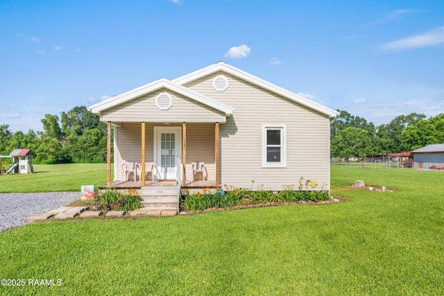 1044 Babineaux Rd, Breaux Bridge, LA 70517 - view of front of home with covered porch and a front lawn