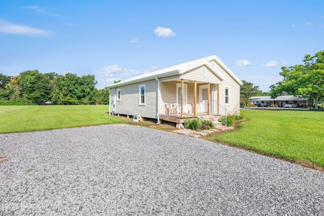 1044 Babineaux Rd, Breaux Bridge, LA 70517 - view of front of house with covered porch and a front yard
