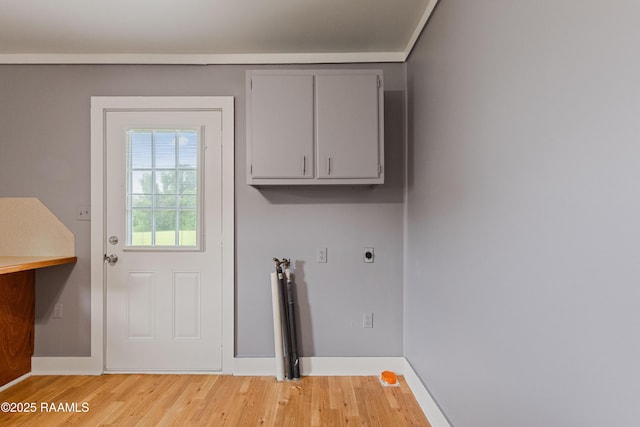 1044 Babineaux Rd, Breaux Bridge, LA 70517 - laundry area with electric dryer hookup, cabinet space, light wood-style flooring, and washer hookup