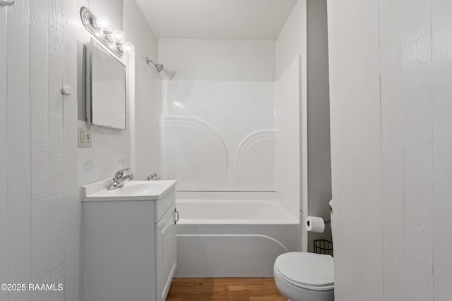 1044 Babineaux Rd, Breaux Bridge, LA 70517 - full bathroom featuring vanity,  shower combination, and wood finished floors