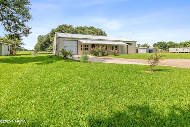 7011 Cameron St, Duson, LA 70529 - view of front of property featuring driveway, an attached garage, and a metal roof