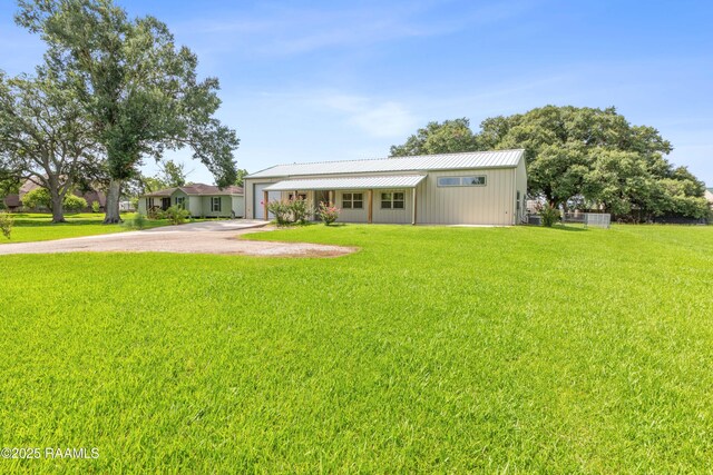 7011 Cameron St, Duson, LA 70529 - view of front of home with a front lawn and driveway