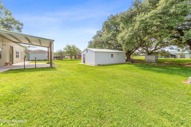 7011 Cameron St, Duson, LA 70529 - view of grassy yard with an outdoor structure and a patio area