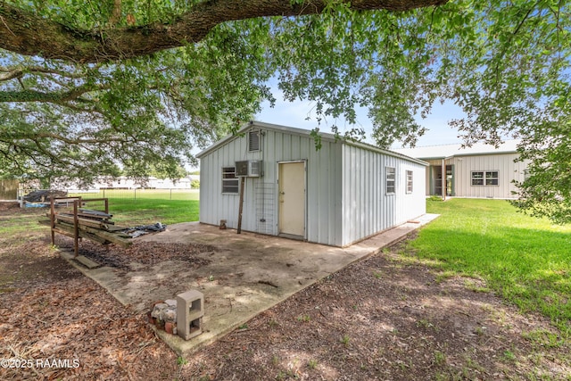 7011 Cameron St, Duson, LA 70529 - view of outdoor structure featuring a wall unit AC