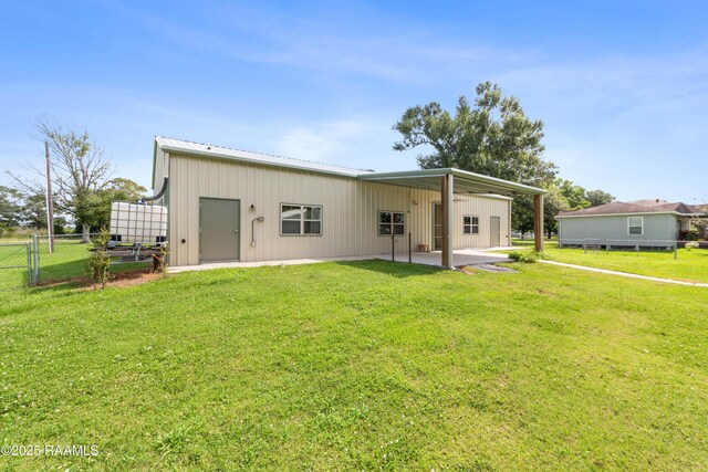 7011 Cameron St, Duson, LA 70529 - rear view of property with board and batten siding, a patio, and a metal roof