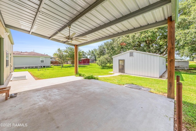 7011 Cameron St, Duson, LA 70529 - view of patio with a ceiling fan and an outdoor structure