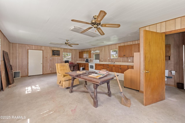 7011 Cameron St, Duson, LA 70529 - dining area with wood walls, concrete flooring, a wall mounted AC, and ceiling fan