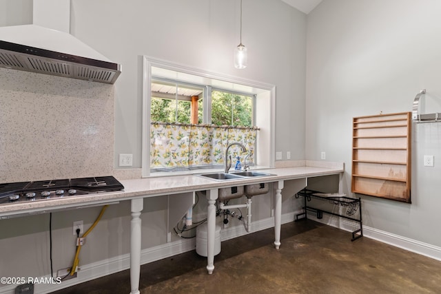 7011 Cameron St, Duson, LA 70529 - kitchen with custom range hood, concrete flooring, stainless steel gas cooktop, a towering ceiling, and hanging light fixtures