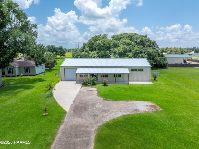 7011 Cameron St, Duson, LA 70529 - single story home featuring covered porch, asphalt driveway, a front lawn, a metal roof, and a garage