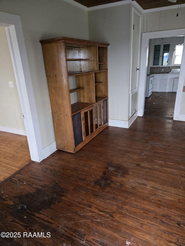 9028 La Cote Rd, Maurice, LA 70555 - spare room featuring dark wood-type flooring and ornamental molding