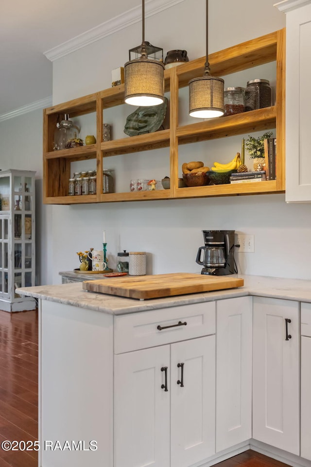 124 Buttercup Dr, Washington, LA 70589 - kitchen featuring open shelves, crown molding, white cabinetry, dark wood-type flooring, and decorative light fixtures