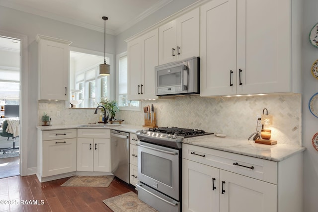 124 Buttercup Dr, Washington, LA 70589 - kitchen with appliances with stainless steel finishes, white cabinets, dark wood-style flooring, hanging light fixtures, and decorative backsplash