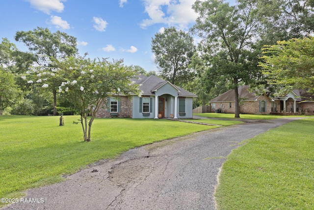 124 Buttercup Dr, Washington, LA 70589 - ranch-style home featuring a front lawn and driveway