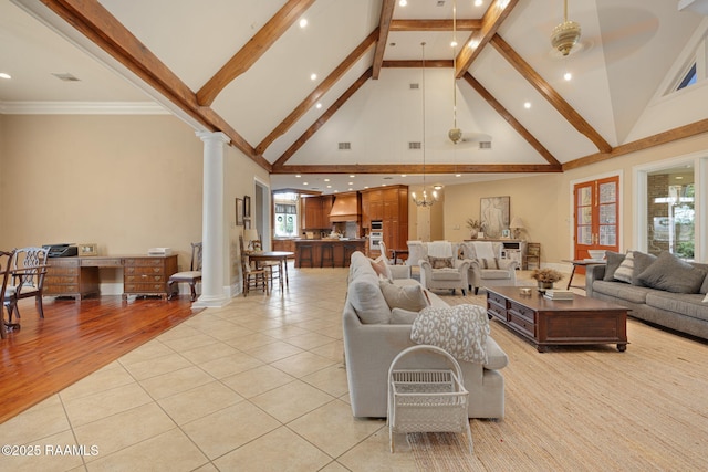 2 Carmel Bnd, New Iberia, LA 70563 - living area with high vaulted ceiling, ornate columns, light tile patterned flooring, beamed ceiling, and recessed lighting