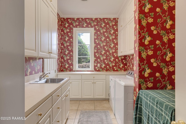 2 Carmel Bnd, New Iberia, LA 70563 - washroom with cabinet space, wallpapered walls, washer and dryer, crown molding, and light tile patterned flooring