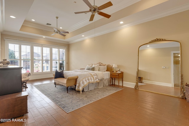 2 Carmel Bnd, New Iberia, LA 70563 - bedroom featuring ornamental molding, a raised ceiling, wood finished floors, recessed lighting, and ceiling fan