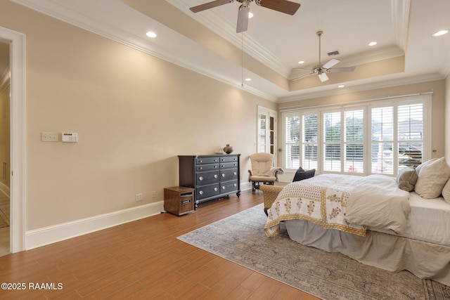 2 Carmel Bnd, New Iberia, LA 70563 - bedroom with wood finished floors, a tray ceiling, recessed lighting, ornamental molding, and ceiling fan