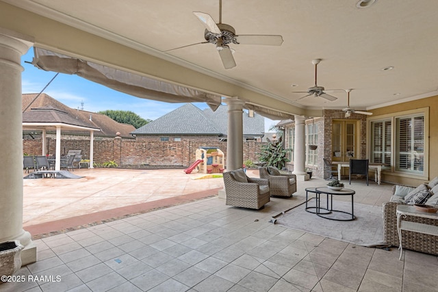 2 Carmel Bnd, New Iberia, LA 70563 - fenced backyard featuring a playground, a patio, a ceiling fan, and an outdoor living space