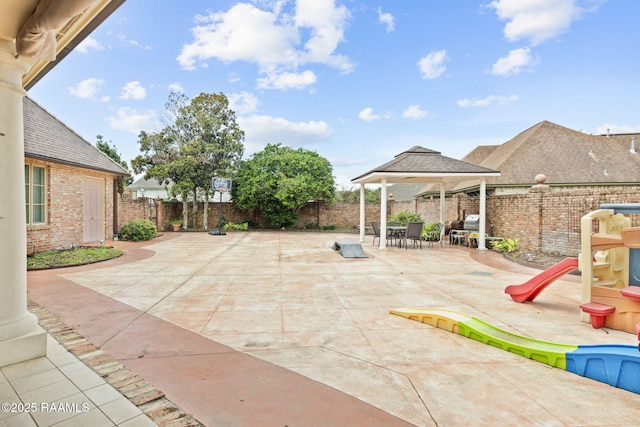2 Carmel Bnd, New Iberia, LA 70563 - fenced backyard with a gazebo, a playground, and a patio area