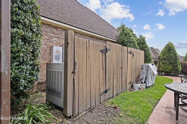 2 Carmel Bnd, New Iberia, LA 70563 - view of side of home featuring a shingled roof and brick siding