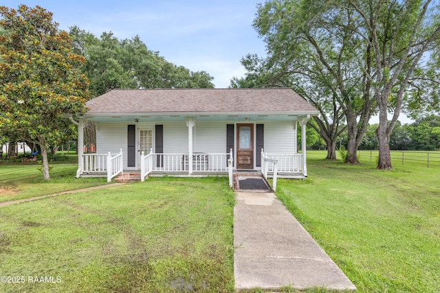1243 Huval Rd, Breaux Bridge, LA 70517 - view of front facade with a porch and roof with shingles