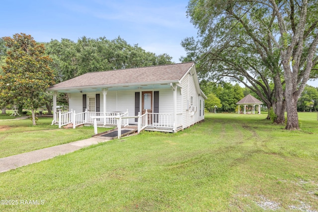 1243 Huval Rd, Breaux Bridge, LA 70517 - view of front of home with a gazebo, covered porch, a front lawn, and a shingled roof