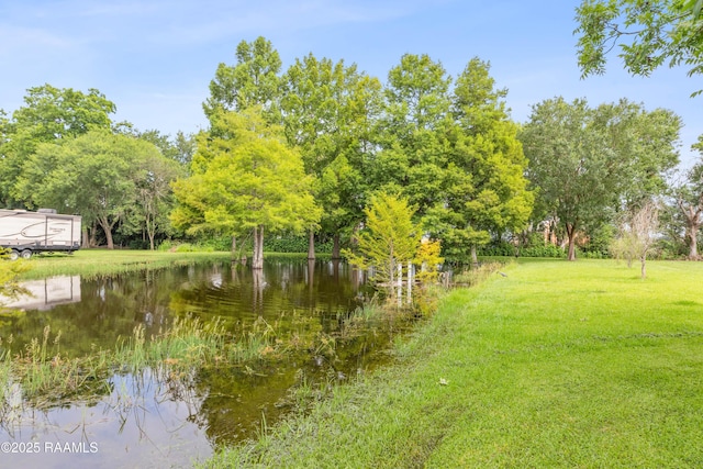 1243 Huval Rd, Breaux Bridge, LA 70517 - view of grassy yard with a water view