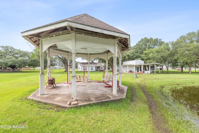 1243 Huval Rd, Breaux Bridge, LA 70517 - view of green lawn featuring a gazebo and a patio