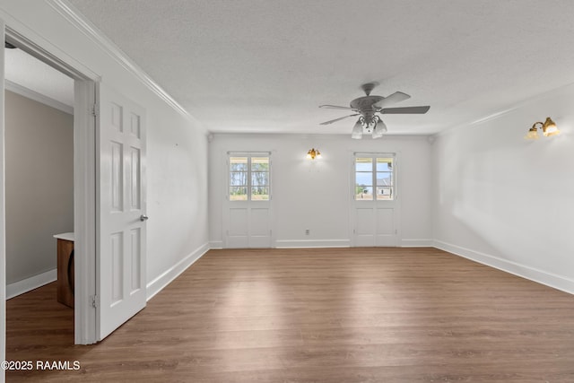 1243 Huval Rd, Breaux Bridge, LA 70517 - spare room with ceiling fan, wood finished floors, a textured ceiling, and crown molding