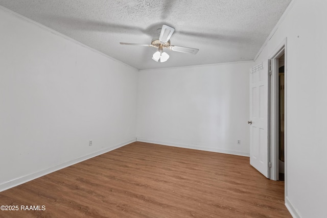 1243 Huval Rd, Breaux Bridge, LA 70517 - unfurnished bedroom with crown molding, wood finished floors, a textured ceiling, and ceiling fan