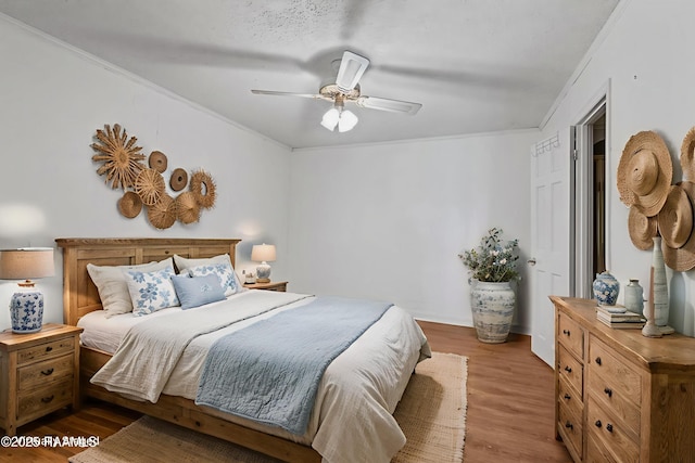1243 Huval Rd, Breaux Bridge, LA 70517 - bedroom with crown molding, wood finished floors, and ceiling fan