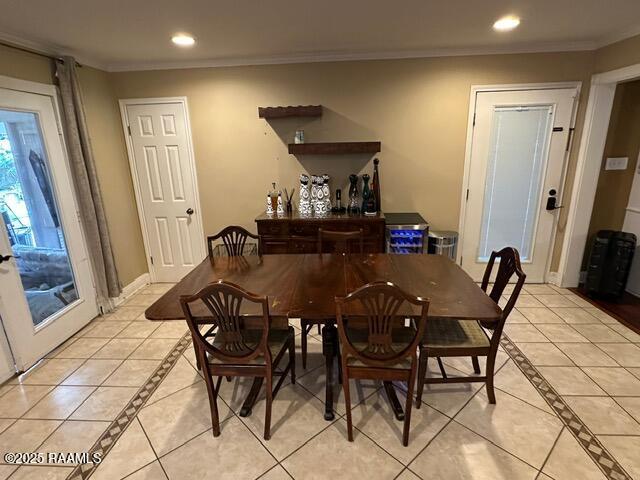 2033 Isadore Rd, Erath, LA 70533 - dining area featuring inlaid floor details, ornamental molding, light tile patterned floors, and recessed lighting