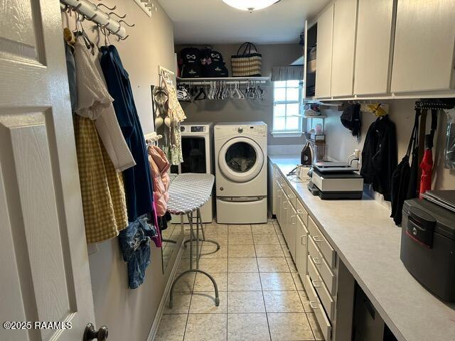 2033 Isadore Rd, Erath, LA 70533 - laundry area with washer and clothes dryer, cabinet space, and light tile patterned flooring