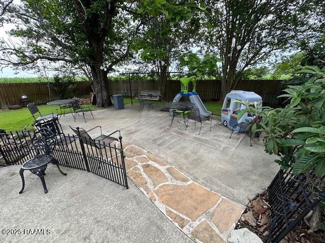 2033 Isadore Rd, Erath, LA 70533 - fenced backyard with a patio area