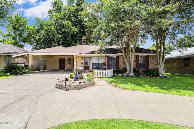 314 Creswell Ave, Scott, LA 70583 - single story home featuring brick siding, a front lawn, concrete driveway, a chimney, and an attached carport