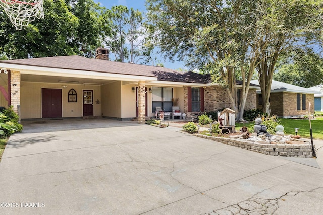 314 Creswell Ave, Scott, LA 70583 - ranch-style home with driveway, a chimney, an attached carport, and covered porch