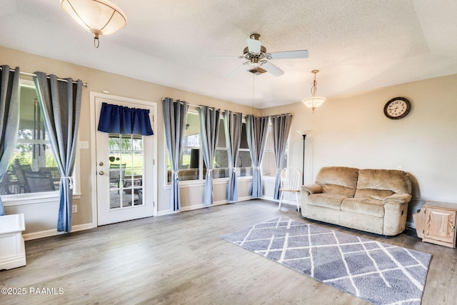 314 Creswell Ave, Scott, LA 70583 - living room featuring a ceiling fan, wood finished floors, and a textured ceiling