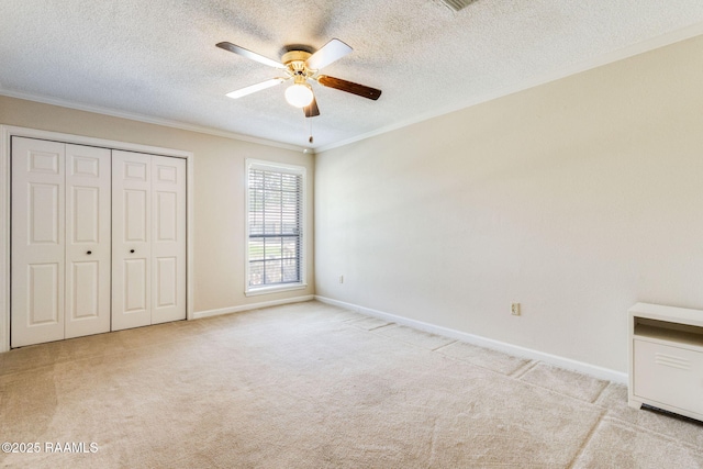 314 Creswell Ave, Scott, LA 70583 - unfurnished bedroom with ornamental molding, carpet floors, a textured ceiling, a closet, and a ceiling fan