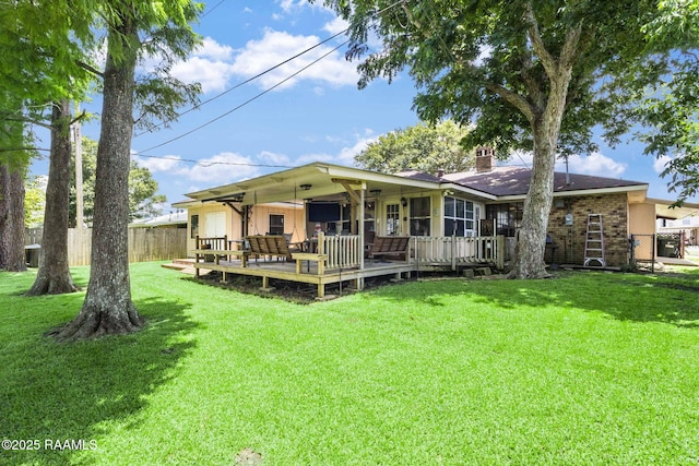 314 Creswell Ave, Scott, LA 70583 - back of property featuring a chimney, a deck, and brick siding