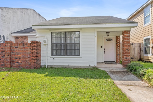 15 Courtyard Cir, Lafayette, LA 70508 - view of exterior entry featuring roof with shingles