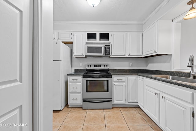 15 Courtyard Cir, Lafayette, LA 70508 - kitchen with stainless steel electric range, dark countertops, freestanding refrigerator, white cabinetry, and a textured ceiling