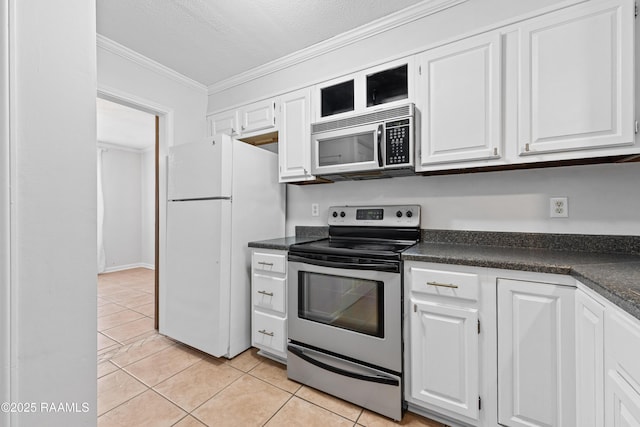 15 Courtyard Cir, Lafayette, LA 70508 - kitchen with stainless steel appliances, dark countertops, crown molding, and white cabinets