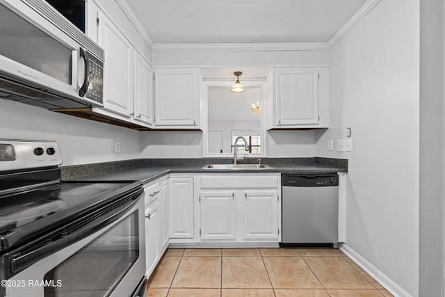 15 Courtyard Cir, Lafayette, LA 70508 - kitchen featuring appliances with stainless steel finishes, dark countertops, white cabinetry, and crown molding