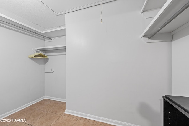 15 Courtyard Cir, Lafayette, LA 70508 - walk in closet with light tile patterned floors