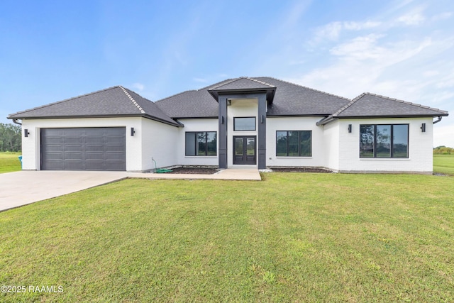 1114 Dermelie Calais Rd, Breaux Bridge, LA 70517 - view of front of home with an attached garage, concrete driveway, a front lawn, and brick siding